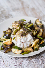 A portion of roasted conger eel with vegetables