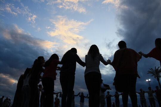 Silhouettes Of People Dancing Horon Or Khoron, Holding Hands. Traditional Circle Folk Dances From Black Sea Region