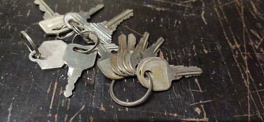 Old keys on the wooden table