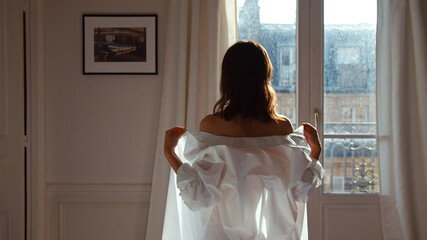 Attractive girl in a white shirt indoors