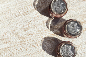 small vacuum glass electronic retro light bulb on the wooden background