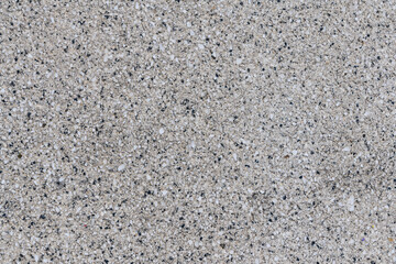 Close-up paving slabs by mosaic. Road paving, construction. Tessellated sidewalk tile. Gray paving cement