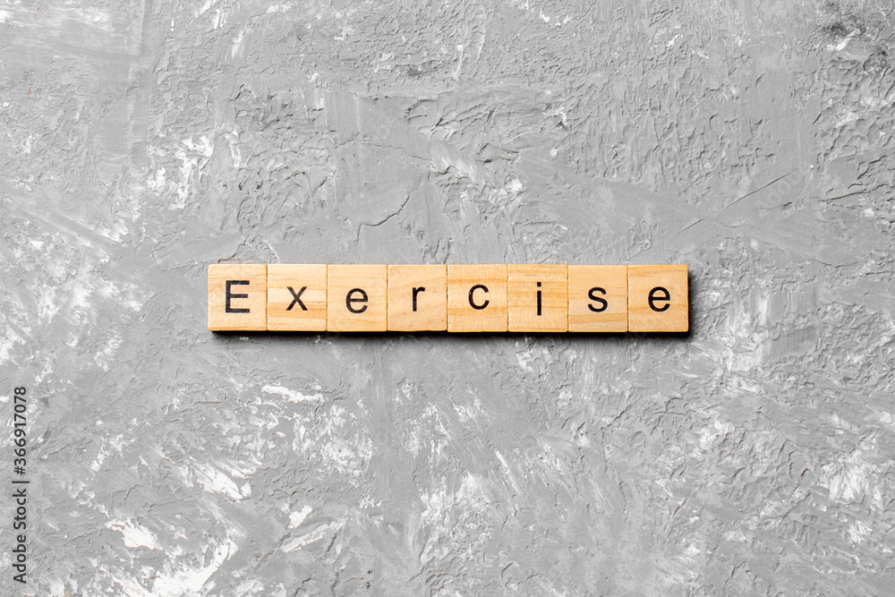 Fototapete exercise word written on wood block. exercise text on table, concept