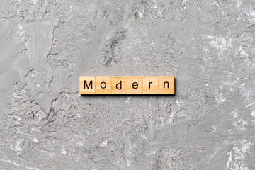 modern word written on wood block. modern text on cement table for your desing, concept