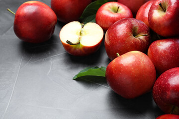 Naklejka na ściany i meble Ripe juicy red apples on grey table, closeup