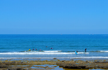 Playa De Las Americas beach surfers