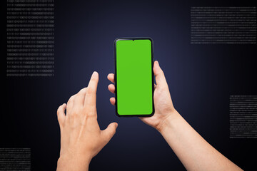 Hands hold the phone with a green chromaque, the rear black blue background