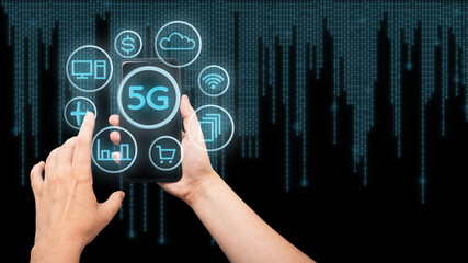 5G Internet is the new technology of the future, linking communication with many applications. Shopping on the Internet, travel, money. Hands hold the phone with a halogram of different applications.