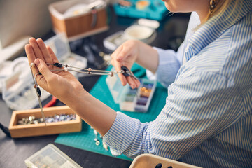 Bijouterie expert holding trendy product in hands