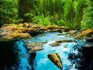 Fototapeta na wymiar Top view on waterfall in the wild. Jukankoski waterfall in Karelia, Russia