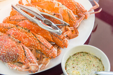 Fresh Grill crab with seafood sauce on dish in Thai style ready to serve in plate