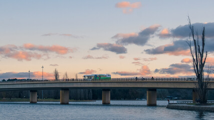  bus running on the bridge over the lake burley griffin © Tonia