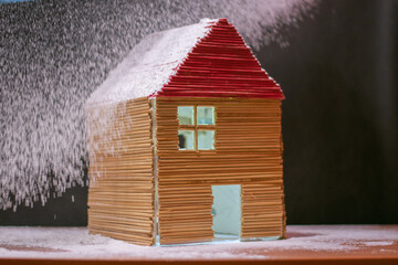 Fototapeta na wymiar a small house in the snow