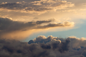 Fototapeta na wymiar Beautiful cumulus clouds. Sunset. Natural background.