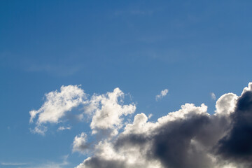 Naklejka na ściany i meble Cumulus clouds. Blue sky. Natural background.