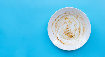 Dirty dish on whiteblue background.