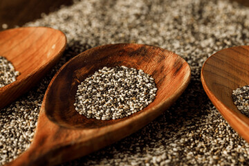 Wooden spoon with chia seeds close up