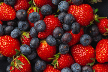 Close up photo of blueberries and strawberries