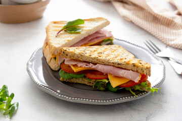 Club sandwich with meat ham, lettuce, cheese. Sandwiches toasted bread. Snack or lunch food.