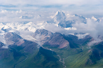 Fototapeta premium Aerial view over the Central Tian Shan Mountain range, Border of Kyrgyzstan and China, Kyrgyzstan