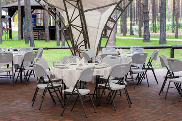 Banquet hall in the restaurant. Table served for festive dinner.