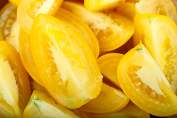 Background from sliced yellow tomatoes.
