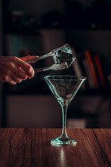 hand holding a glass of cocktail