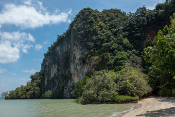 Fototapeta na wymiar Wooded mountain at East Railay Beach, near Ao Nang in southern Thailand.