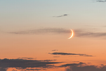 Young crescent moon on evening sky, nature background