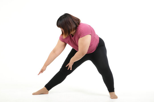 Fat Asian women exercise stretching muscles. In order to want to lose weight. The concept of health care to be healthy and disease free. White background