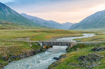 Wooden bridge over a Mountain river, Naryn gorge, Naryn Region, Kyrgyzstan