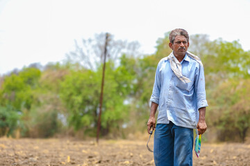 Indian farmer at his agriculture field