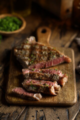 Roasted beef steak on a wooden desk