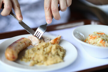 Sausage dish and garnish with salad closeup. Proper nutrition and healthy lifestyle concept