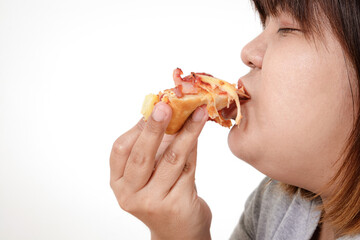 Fat Asian woman eating pizza happily. The concept of weight loss, choosing foods that are good for the body and health. White background. isolated