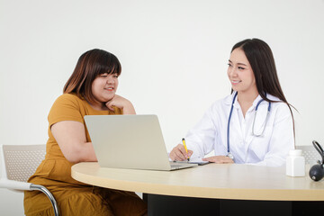 Female doctors perform treatment and examine symptoms of obese female patients. At risk of obesity and diabetes. Weight loss concept For good health