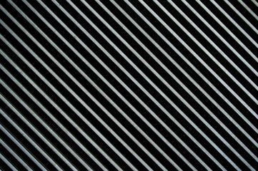 abstract background with diagonal metallic stripes in gray and black