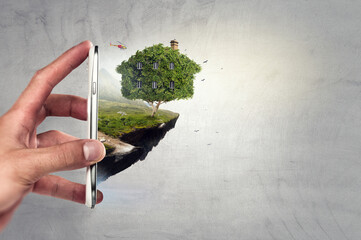 Hand holding green house . Mixed media