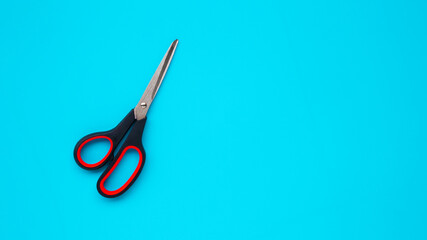 Scissors on blue background.scissors on blue background for banner or card. Copy space.