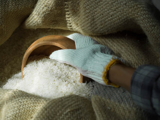 Jasmine rice in hemp sack. Staple food of Thai people.