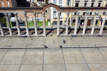 Fototapeta premium Europe, Italy, Milan July 2020 - drone aerial view of San Lorenzo column and basilica after Covid-19 Coronavirus lockdown - downtown without tourist who visit the city 