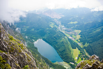 View from the top of the mountain to Leopoldsteinersee mountain lake and Eisenerz with the Erzberg in beautiful alpine landscape.