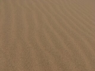 close-up on smooth sands in windy weather 