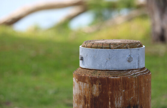 Timber and galvanised steel bollard in a coastal park. Silver Beach, Sydney
