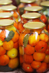Glass containers with tomatoes.