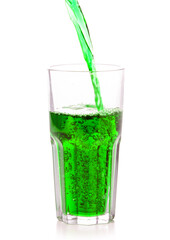 Glass of sweet green carbonated water on white background isolation