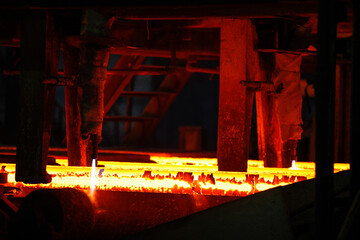 Steel billets at torch cutting in metallurgical plant. Metallurgical production, heavy industry,...