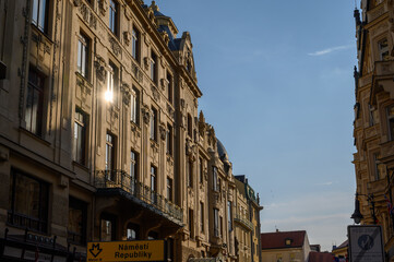 Fototapeta premium Early evening sunlight reflecting in the windows of old buildings in Prague, Czech Republic