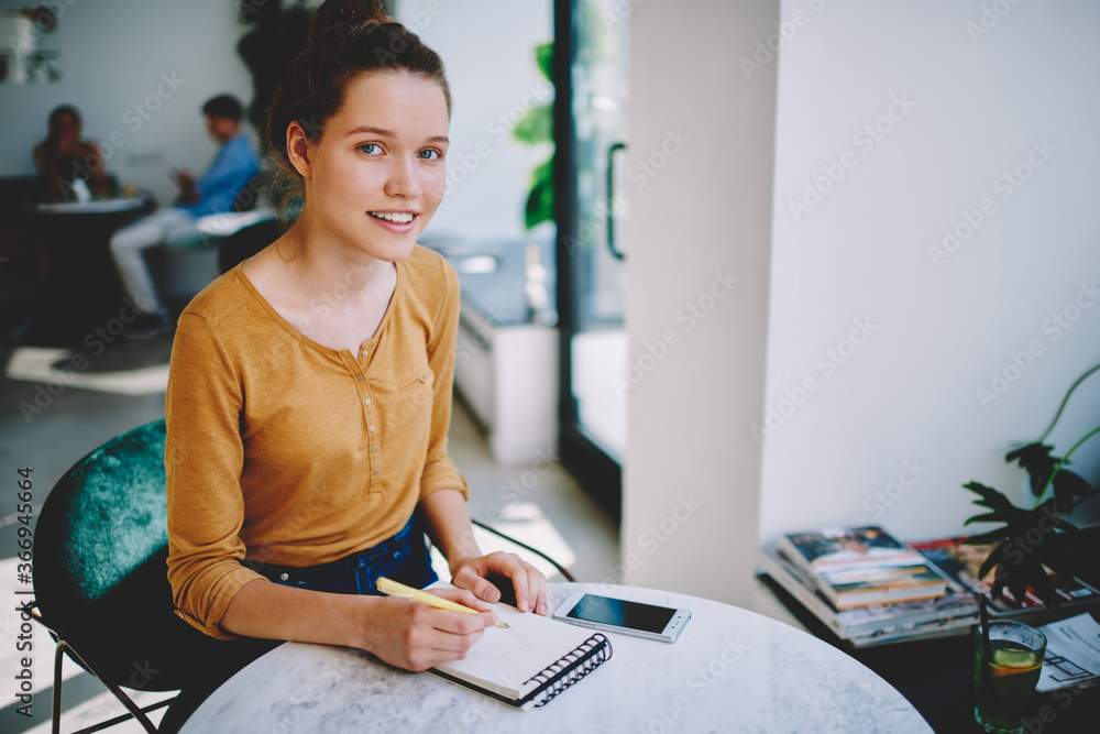 Aufkleber portrait of beautiful clever student doing homework writing in notepad,attractive graphic designer e