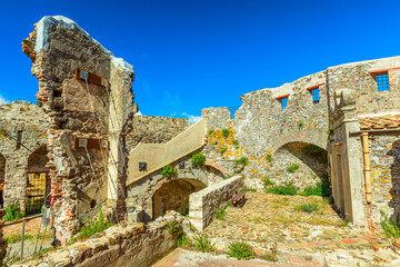 Ancient walls of the never conquered fortress Volterraio. Located between Portoferraio and Rio nell'Elba. Elba Island, Tuscany, Italy.